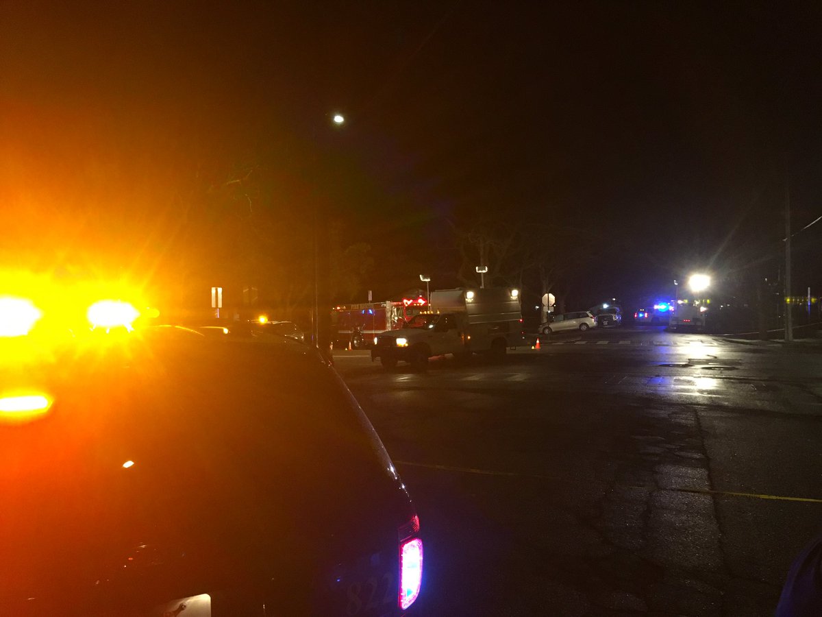 Large crime scene in downtown Davis. Officer shot and killed after responding to a car crash. A Davis police vehicle is at the scene with several bullet holes in the back window. 