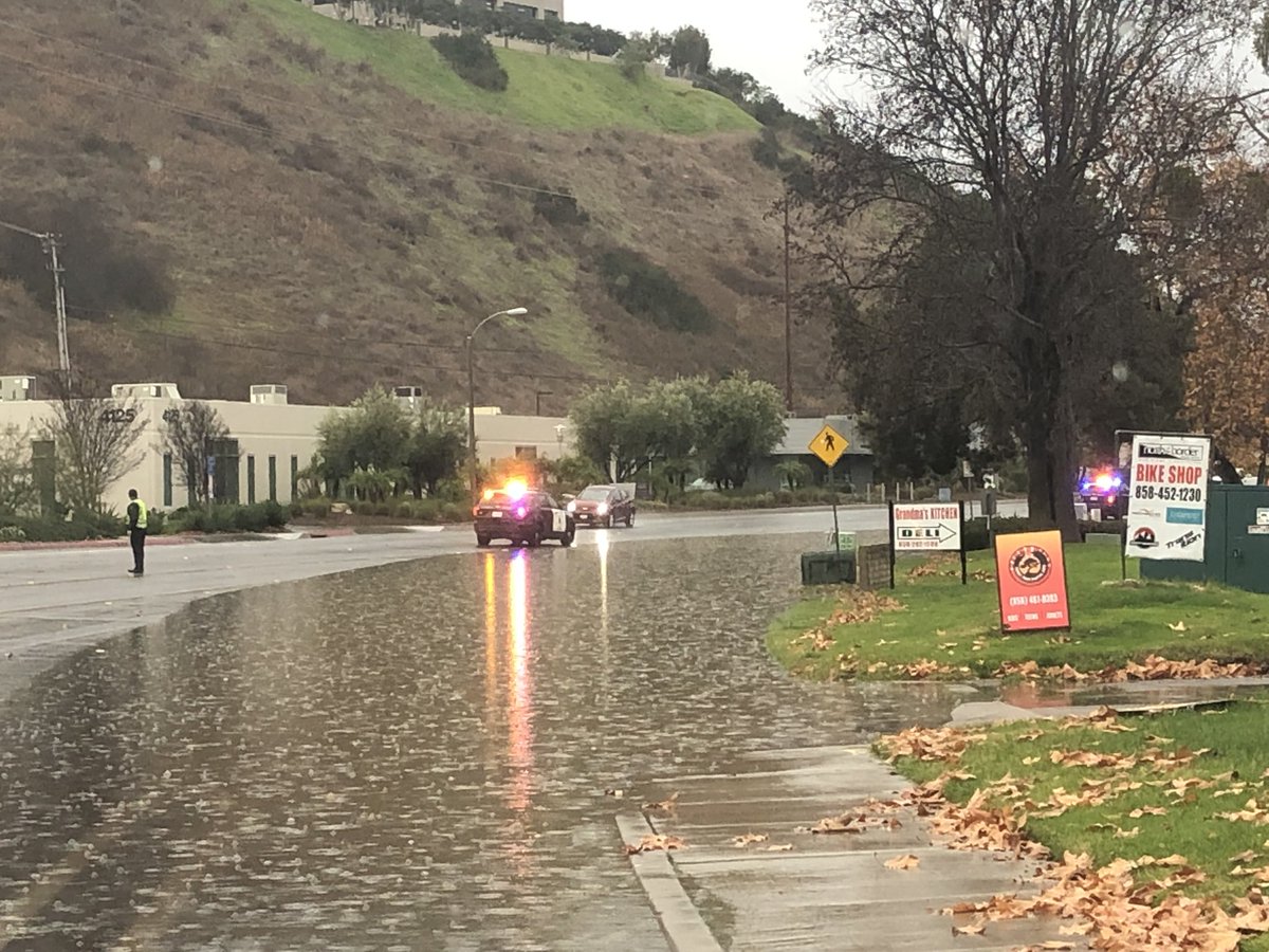 Flooding in 4200 block of Sorrento Valley. Traffic down to one lane