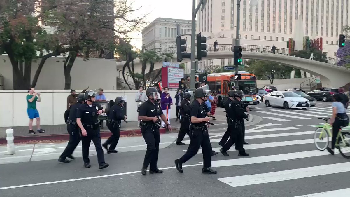 LAPD arriving in riot gear to multiple downtown LA intersections where protesters are blocking traffic. @FOXLA