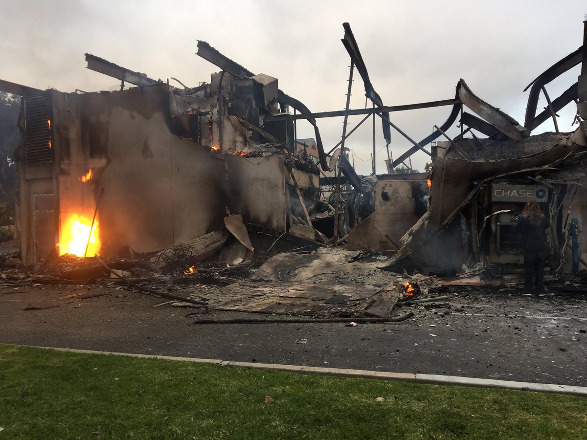 Waking to the charred ruins of Chase Bank & Union Bank in LaMesa.  Looters set the Spring Street banks on fire Saturday night. Flames were still feeding on the buildings Sunday morning  