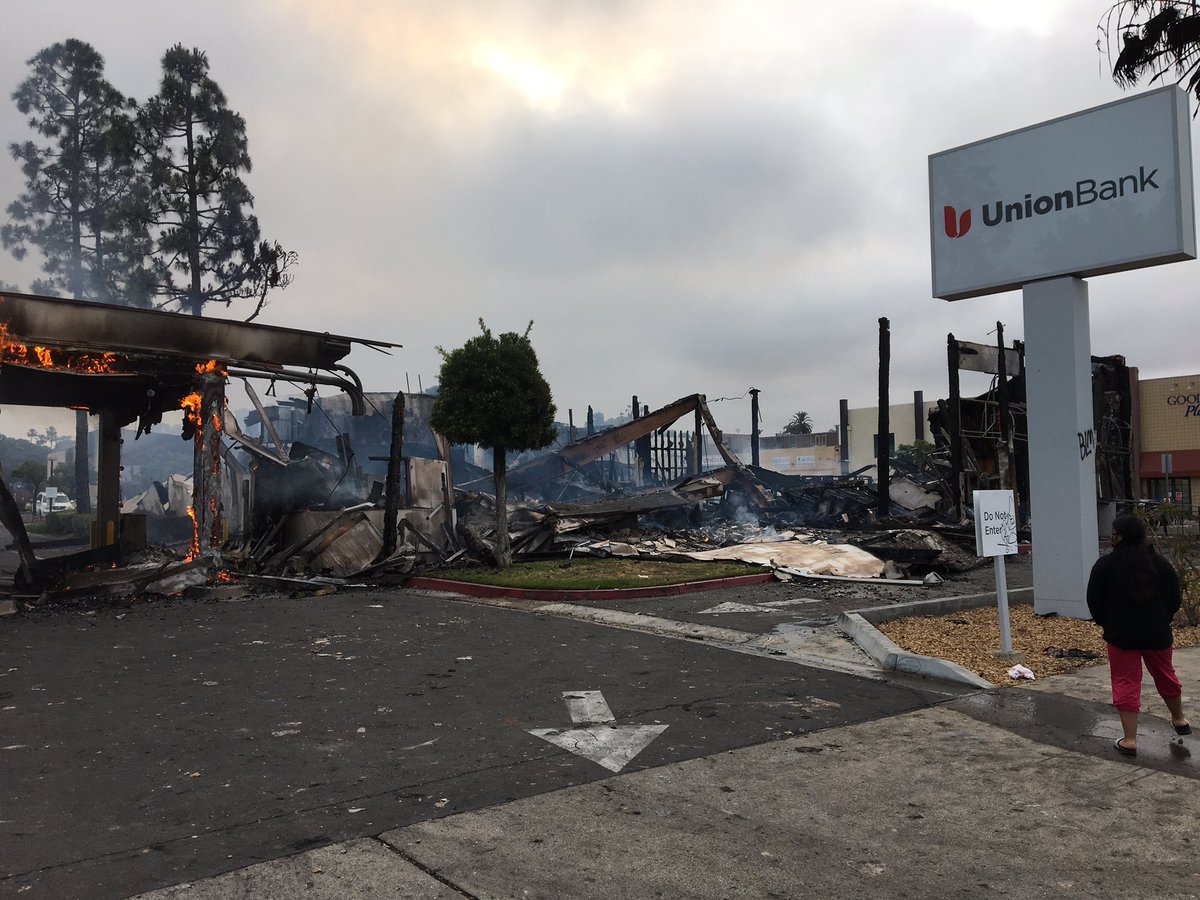 Waking to the charred ruins of Chase Bank & Union Bank in LaMesa.  Looters set the Spring Street banks on fire Saturday night. Flames were still feeding on the buildings Sunday morning  