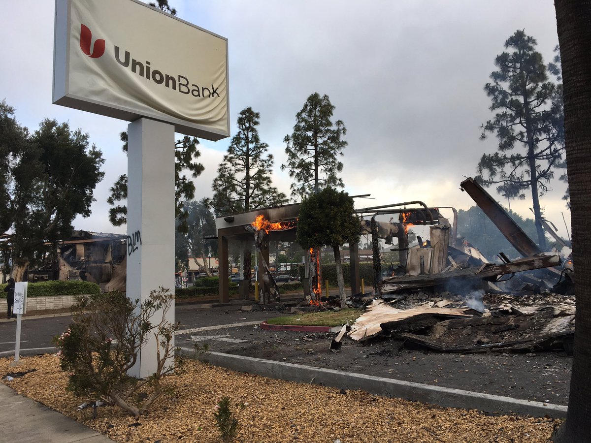 Waking to the charred ruins of Chase Bank & Union Bank in LaMesa.  Looters set the Spring Street banks on fire Saturday night. Flames were still feeding on the buildings Sunday morning  