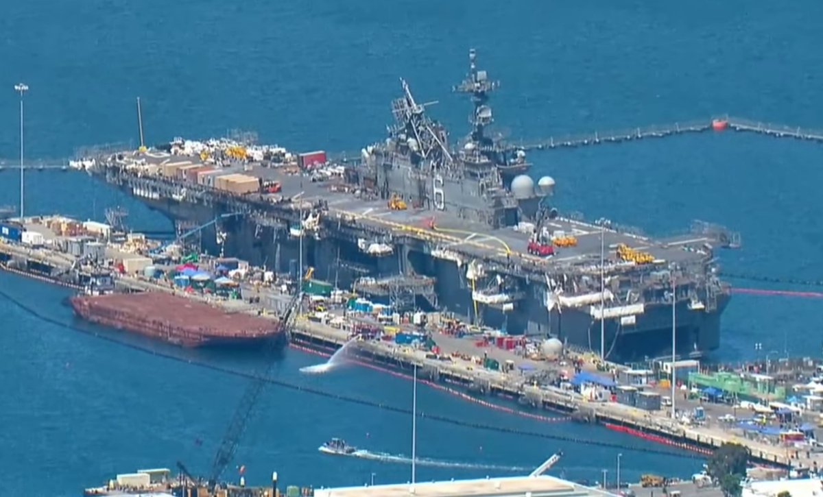 Pictures from CBS8 San Diego of USS BONHOMME RICHARD LHD6 at Naval Base San Diego, seen around 11 AM PDT. The fire has   been declared out. News conference upcoming in about 10 minutes at