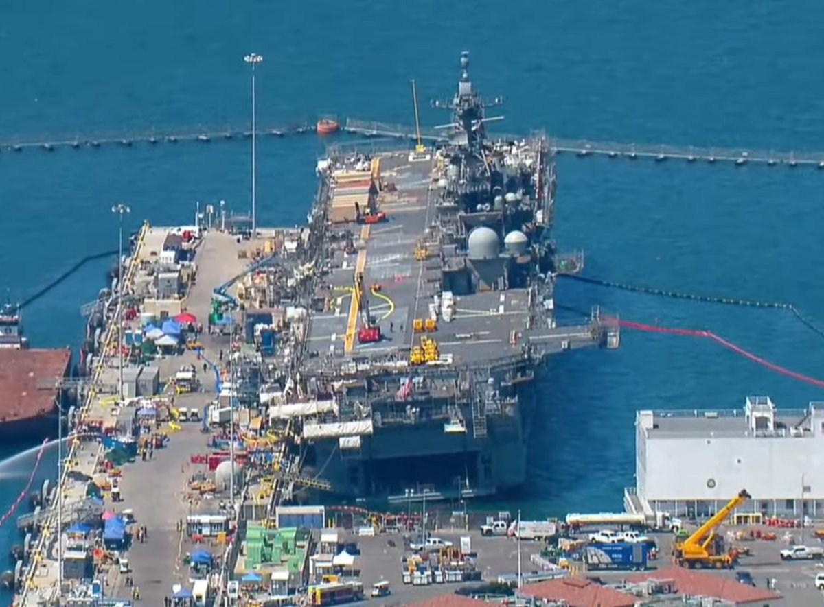 Pictures from CBS8 San Diego of USS BONHOMME RICHARD LHD6 at Naval Base San Diego, seen around 11 AM PDT. The fire has   been declared out. News conference upcoming in about 10 minutes at