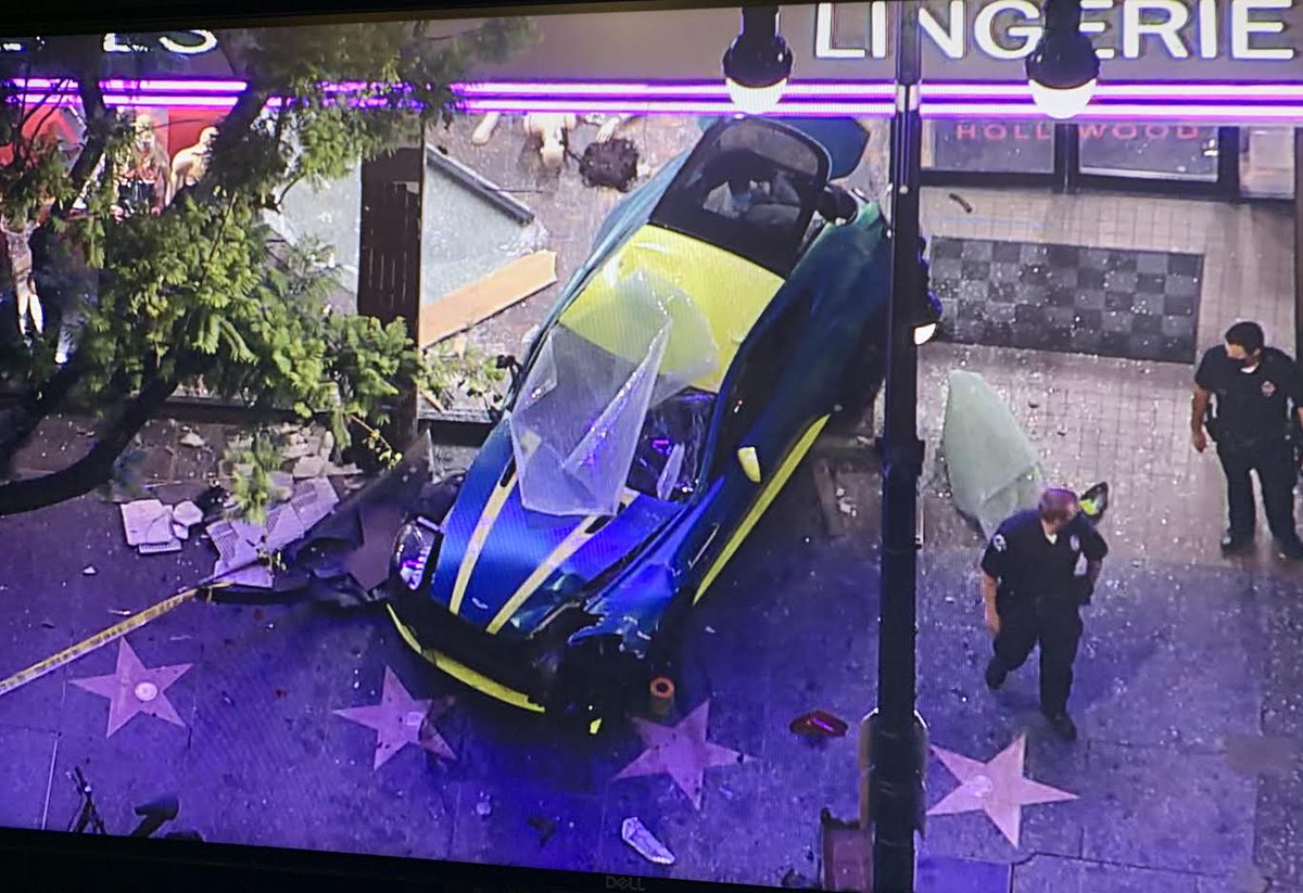 Three car crash sends an Aston Martin Vantage GT into the Hustler store on Hollywood Blvd