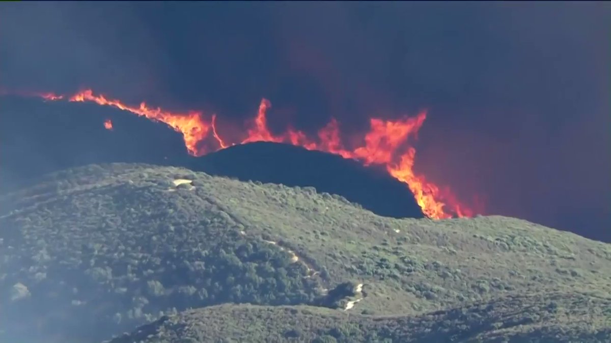 Fire in Lake Hughes area explodes as firefighters battle to save communities