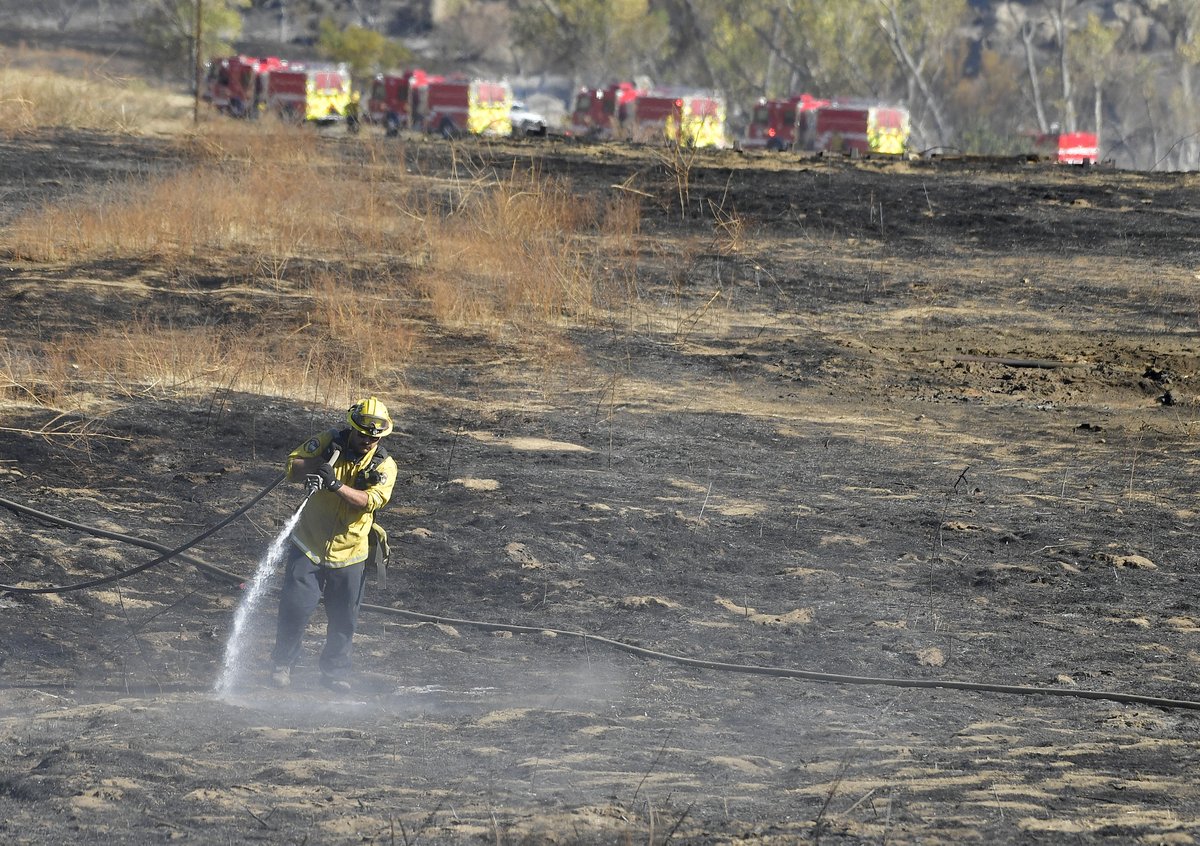 Firefighters put out hot spots from the #cerritosfire near #hemet Thursday morning. The fire has burned approximately 200 acres.