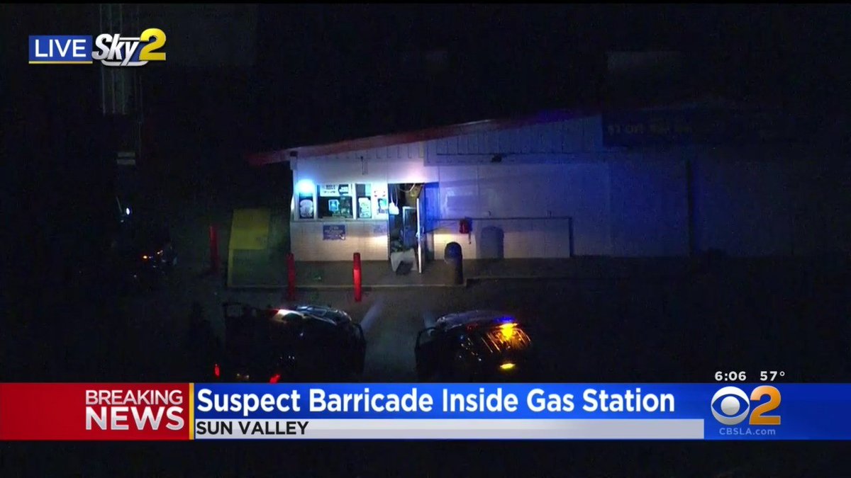 After keeping police at bay for more than two hours at a Sun Valley gas station, an attempted robbery suspected has surrendered to authorities and is in custody