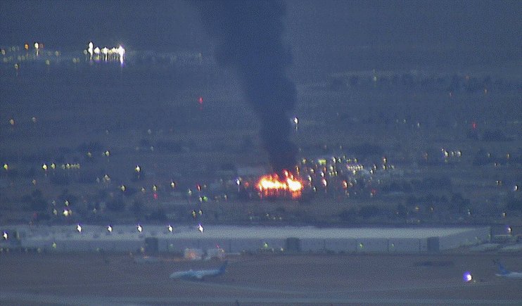 Victorville on the 15fwy.   A structure fire is burning to the west of town and putting up a large plume of smoke not far from Southern California Logistics Airport