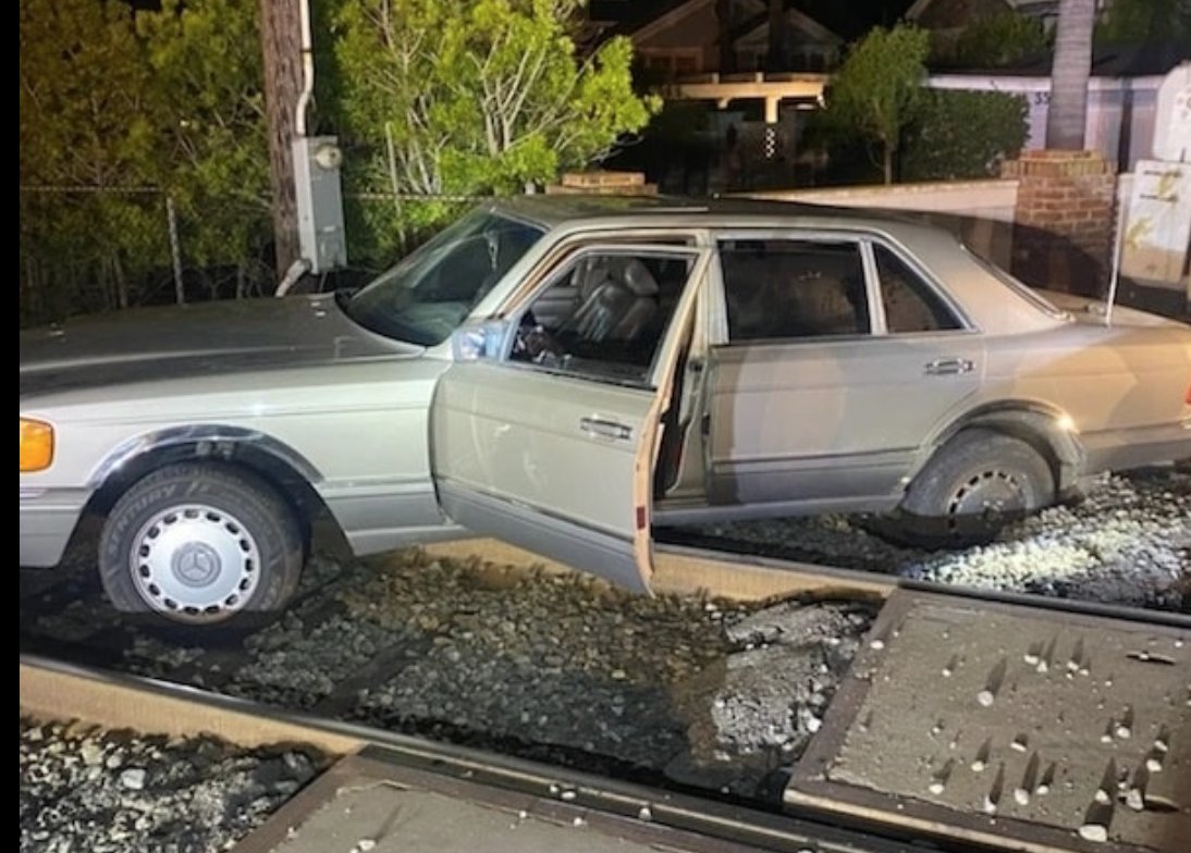 TRAINS WERE STOPPED while the California Highway Patrol - Santa Barbara had this vehicle towed off the tracks at Padaro Lane at Santa Claus Lane in Carpinteria Saturday night.  The driver was arrested for suspected drunk driving