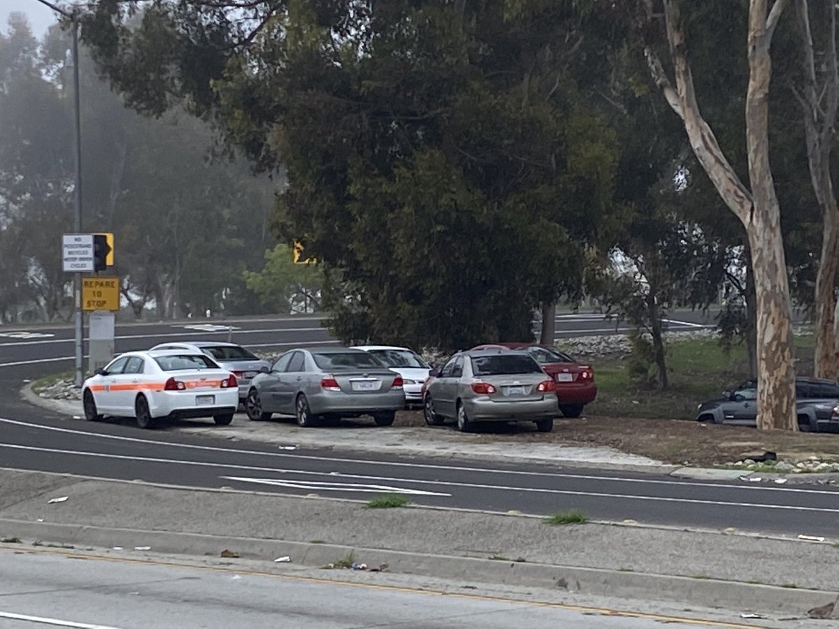 Cleanup crews & CHP officers have arrived here at Century &amp; the 405 to cleanup a homeless camp next to the freeway.  Critics think the cleanup is aimed at hiding the homeless problem from fans who are coming to the SuperBowl