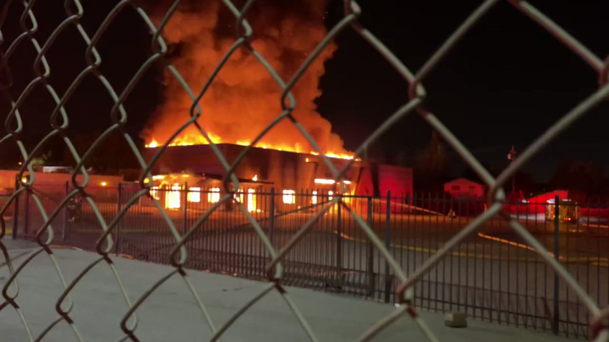 Firefighters are battling a two-alarm structure fire on El Camino Real in Santa Clara.