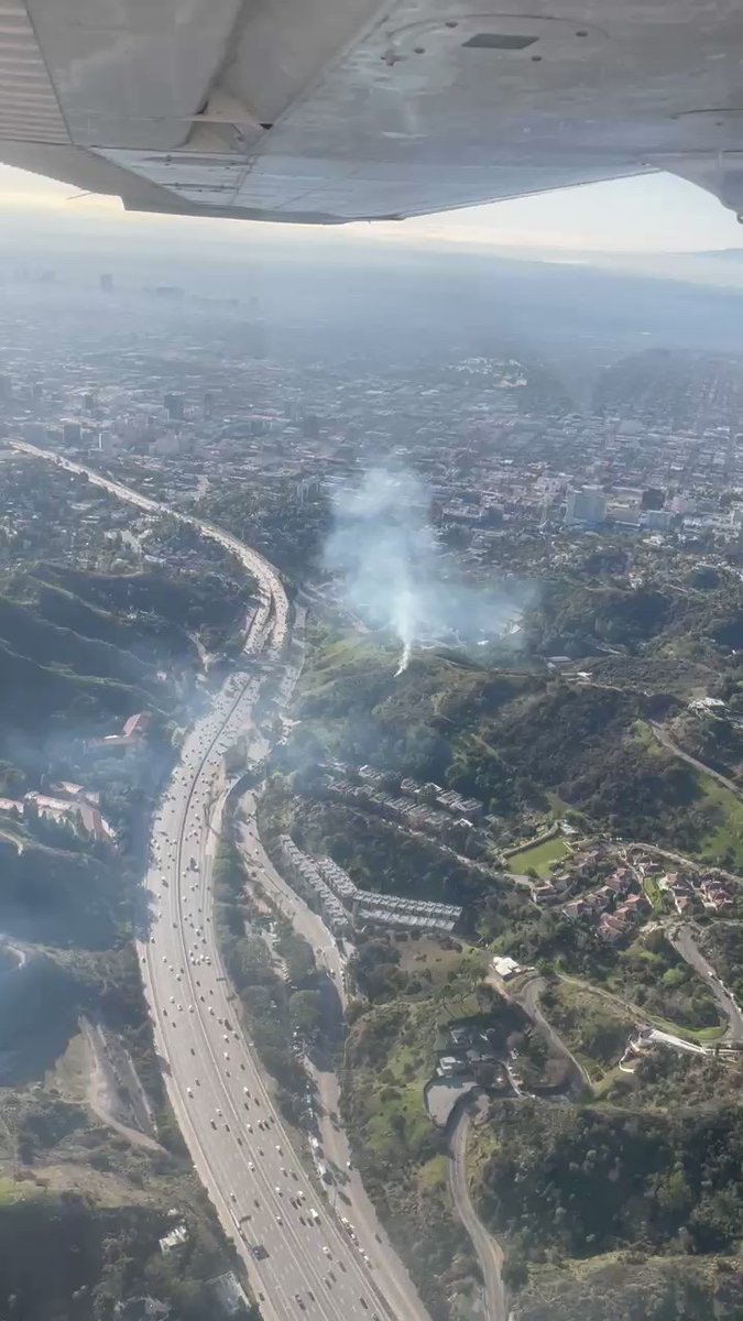 A small grass for burning in the hills above The Hollywood Bowl.. LAFD is bringing equipment to southbound caheunga west at the highland off.