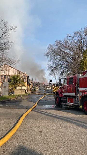 Commercial fire at Diamond Walnut Facility forces shutdown of Highway 99 as crews pull water from multiple hydrants around the area to contain it