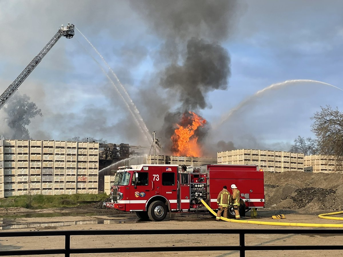 Fire continues burning in the hundreds of bins stacked around the property edges. A column of black smoke can periodically be seen as the fire finds the right fuel and oxygen combination and flames flare up. We continue to have 5 engines and a BC committed