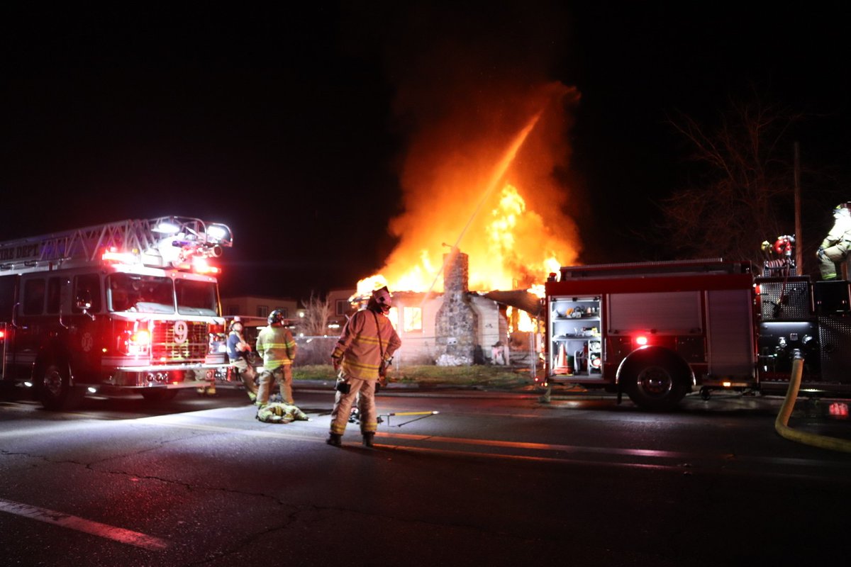 Several crews are battling a large house fire in northwest Fresno