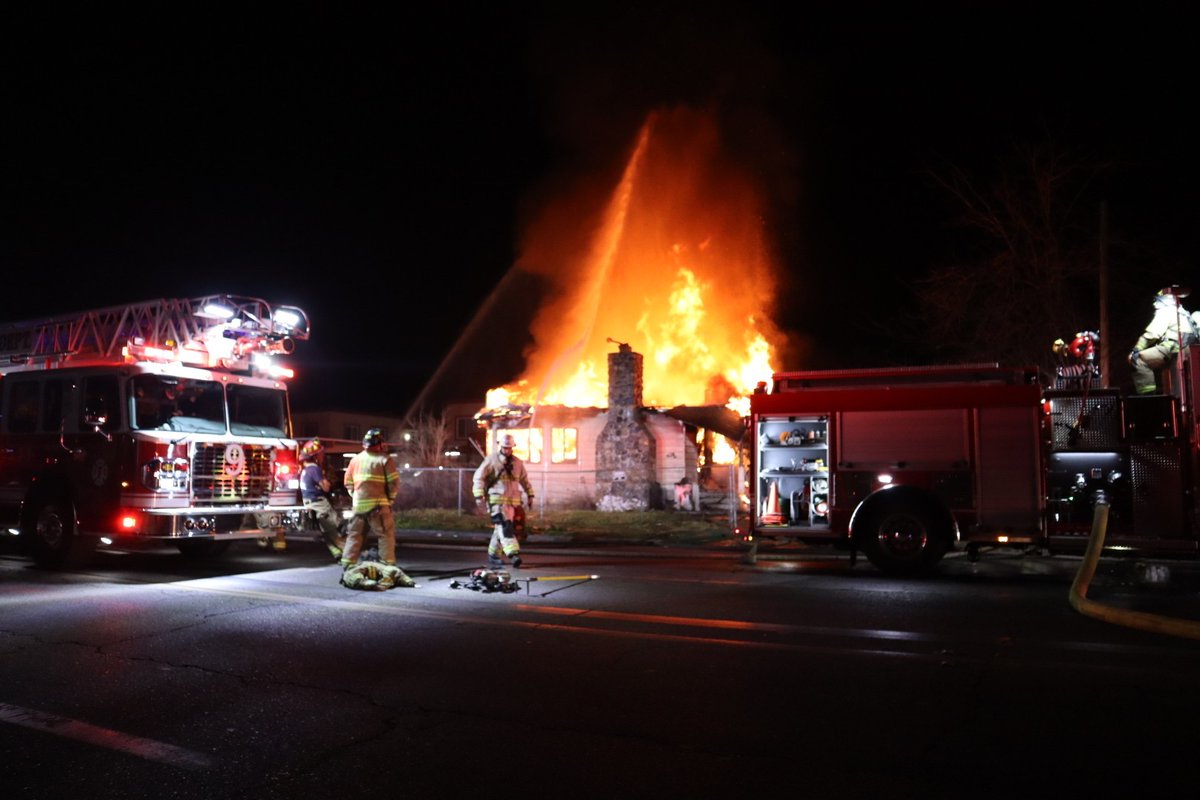 Several crews are battling a large house fire in northwest Fresno