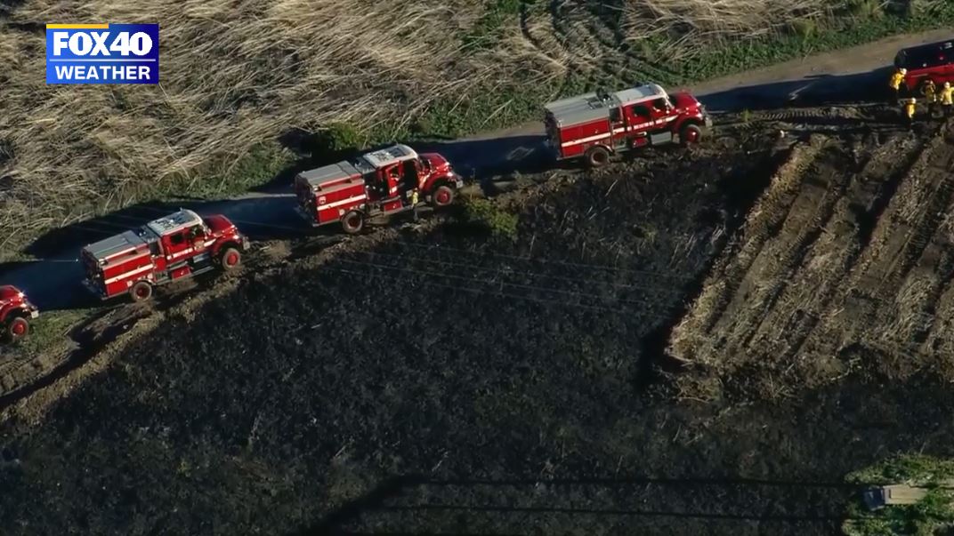 dry the brush is and how close to coast the Emerald Fire is burning