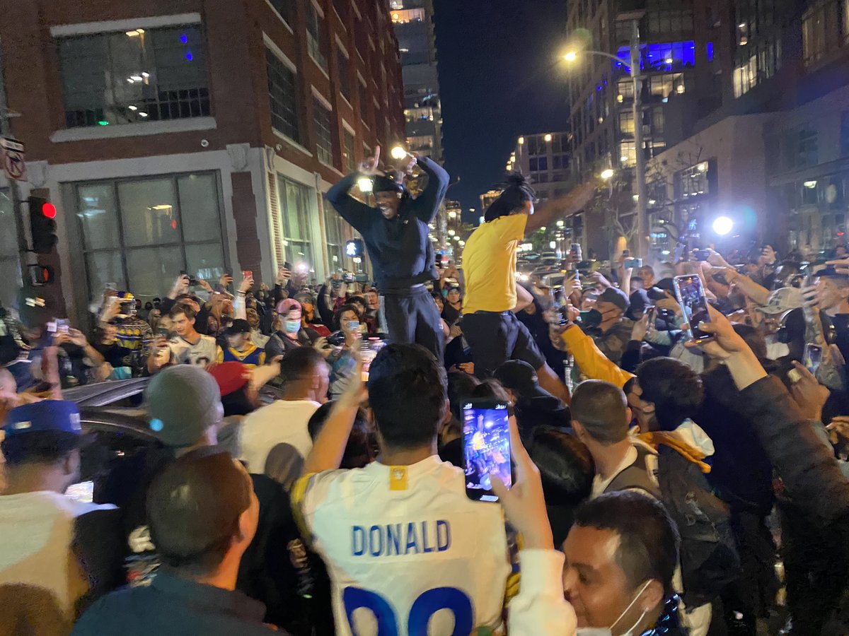 11th and Hope in downtown L.A. in an area LAPD have cordoned off.  People are letting off fireworks.  Police on bullhorns declared an unlawful assembly on a loudspeaker from a truck and told people they had 10 minutes to leave