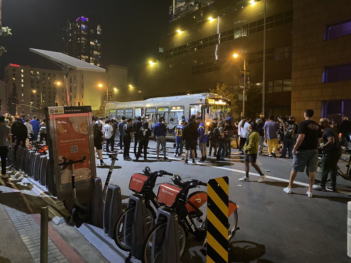 People got inside the bus and were setting off fireworks inside of it. It's smoking. One person just passed me holding his injured hand screaming fuck.  Police moved in on bikes with sirens blazing — and crowd ran off