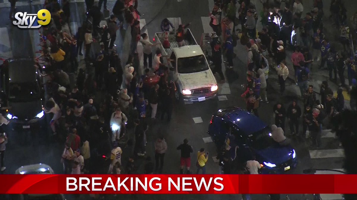 Problematic celebrators were seen jumping on top of a white pickup truck as police tried to disperse the crowd. LAPD declared an unlawful assembly