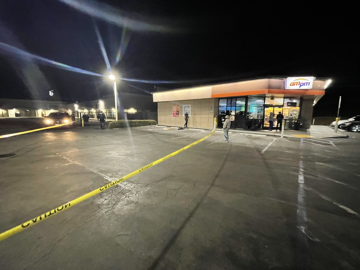 2nd shooting scene at Arco Gas station one block from Red Roof Inn. Police taping off parking lot with what looks to be bloody clothing on ground