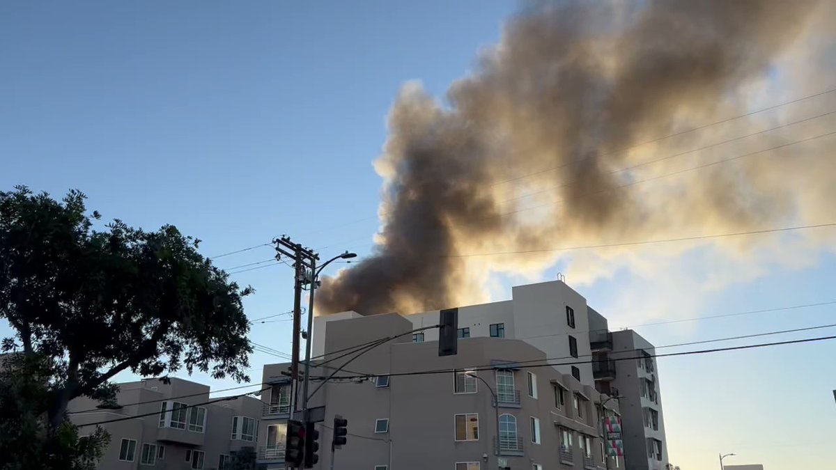 Major fire burning in Downtown LA on San Pedro between 6th and 7th. Fire started as a rubbish fire outside and quickly spread into building housing toy company