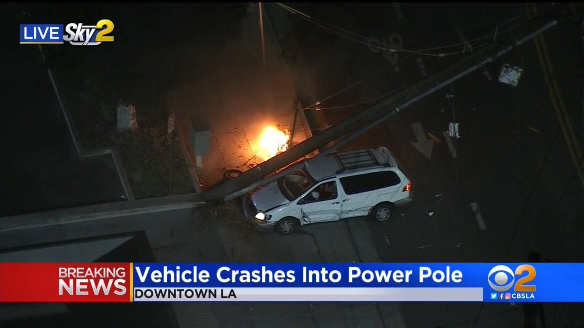 Scene of a crash in downtown LA. A vehicle crashed into an electrical pole which sparked a fire. Crews have yet to approach the fire due to downed wires