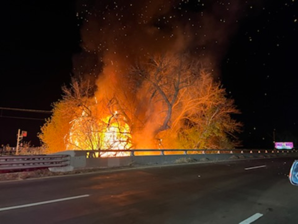 VegetationFire  N 12th and Richards Blvd  Sacramento Fire crews are on scene of a large vegetation fire in the area of Highway 160 and N 12 St.  The brush fire was approaching the lines for the light rail and it was requested to shut down light rail traffic