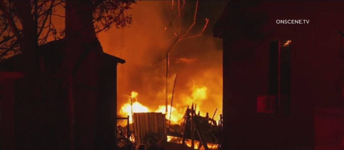 A fire driven by 40 mph winds tore through a mobile home park in Fontana early this morning. Firefighters had to contend with downed power lines and live ammunition