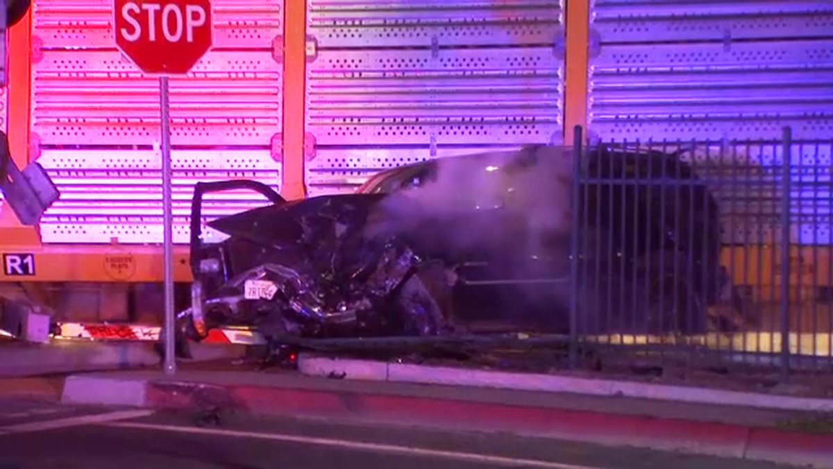 Fresno police are searching for one of three men who took off after crashing near CRMC and abandoned their SUV on the railroad tracks