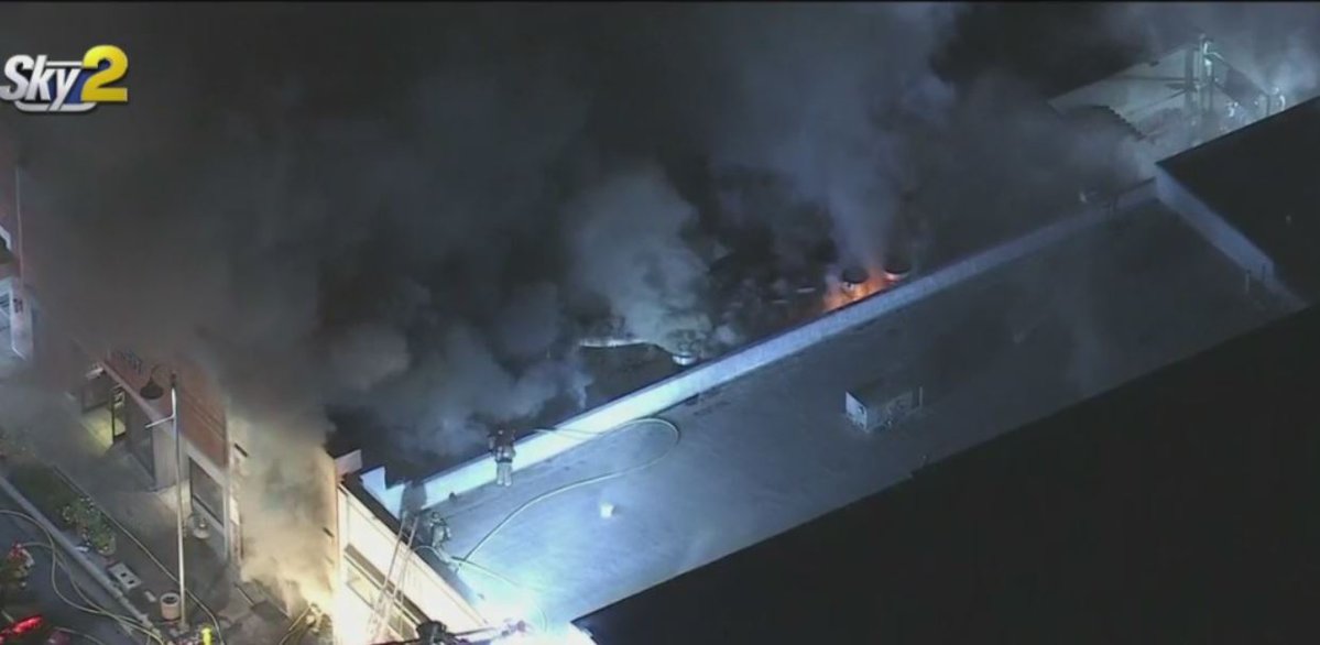 Crews are battling a large fire at a sports bar in Downey called the 20/20 Draft House