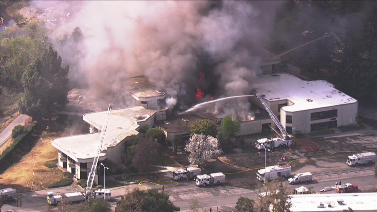 A vacant 3-story commercial building in Campbell was burning wildly on Friday morning