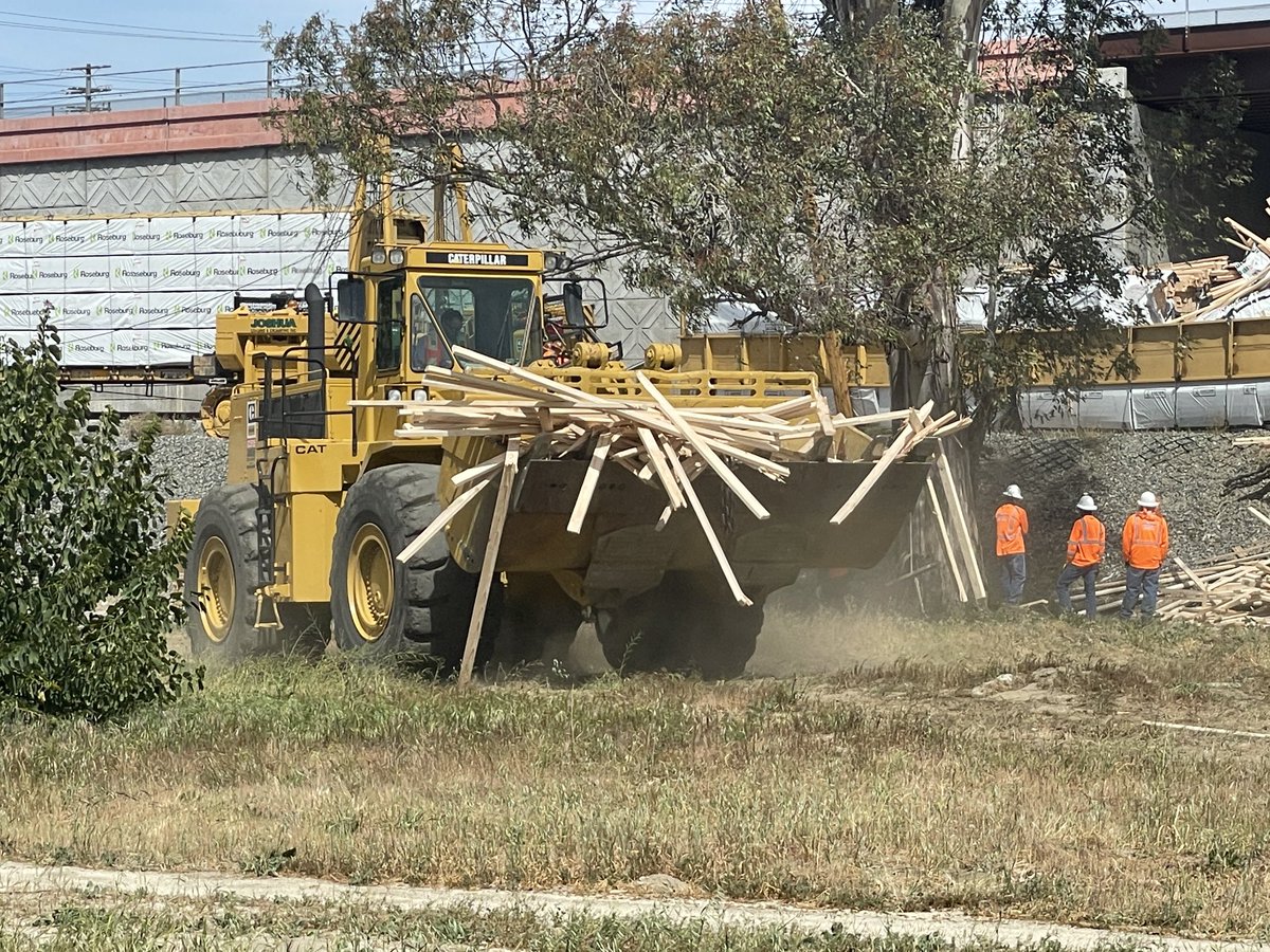 A freight train carrying lumber derailed in Colton this morning; 13 cars derailed. There is a small diesel spill that is being cleaned up. One moderate injury reported involving one of the cleanup workers