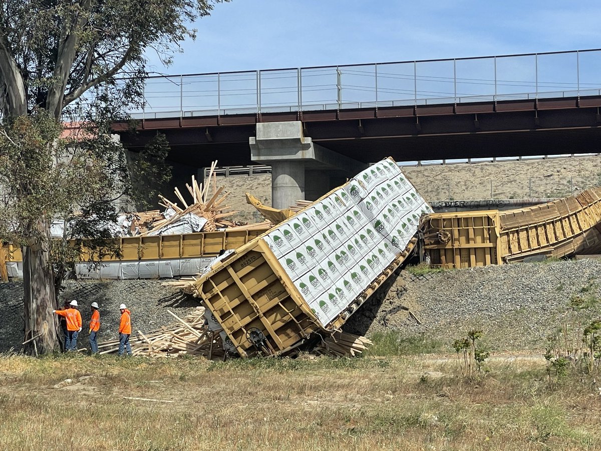 A freight train carrying lumber derailed in Colton this morning; 13 cars derailed. There is a small diesel spill that is being cleaned up. One moderate injury reported involving one of the cleanup workers