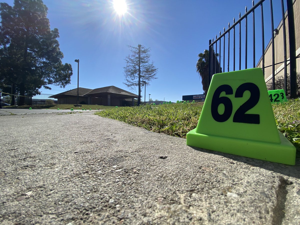 At least 62 evidence markers dot this Stockton parking lot on Knickerbocker and West, hours after an 18-year-old died and three other people were shot Tuesday around midnight, per police