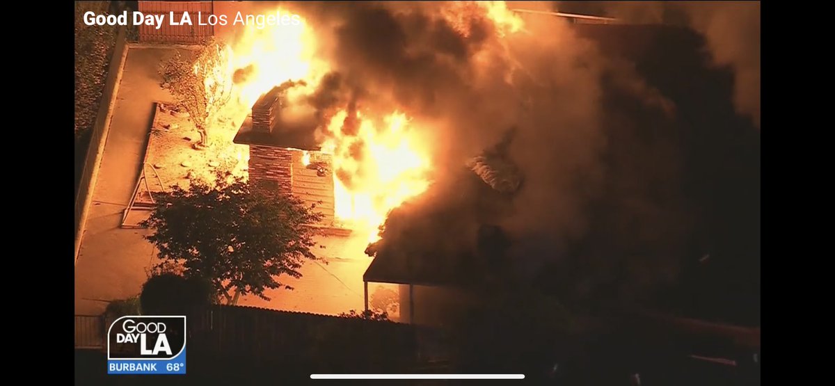 House on fire on Pelon Way in Monterey Park. At least two occupants appear to be out safely