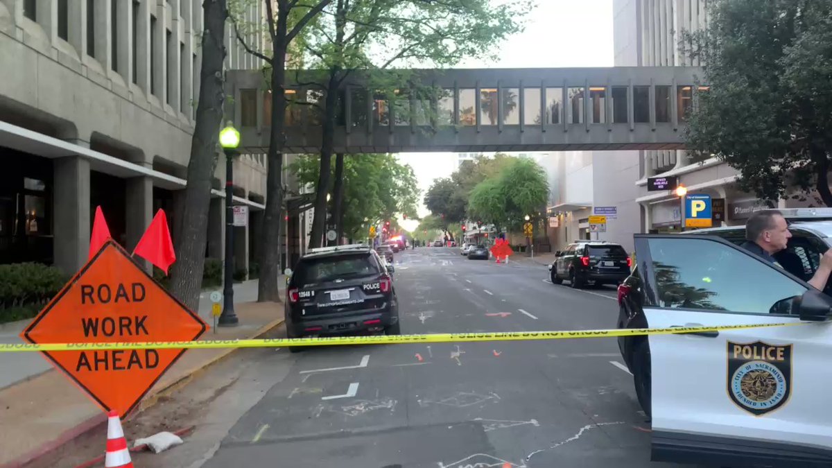 This Sunday morning in Sacramento a mass shooting in the area of 10th & K St. 6 people are dead, 9 others injured.   This vantage point is 10th &amp; L St. More than 2 dozen evidence markers on scene, glass shattered