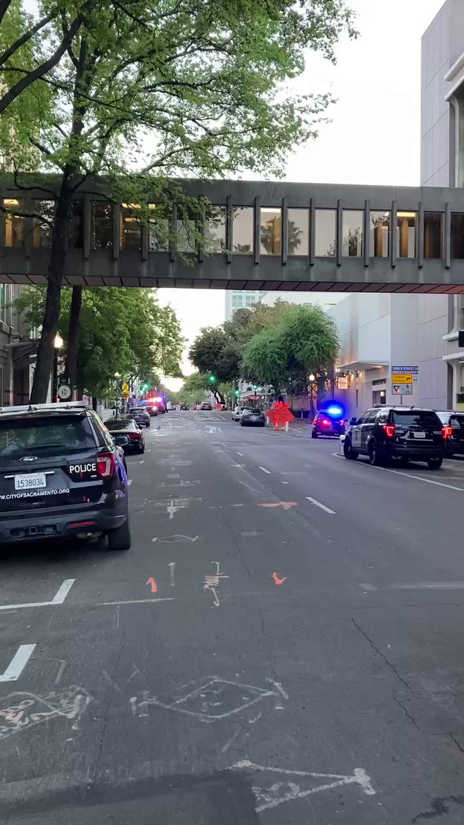 This scene is steps from a symbol of state politics, the Capitol building. Staring the other way you'd see caution tape, evidence markers, police and the rotunda peaking through trees.   This mass shooting, near the heart of Sacramento politics