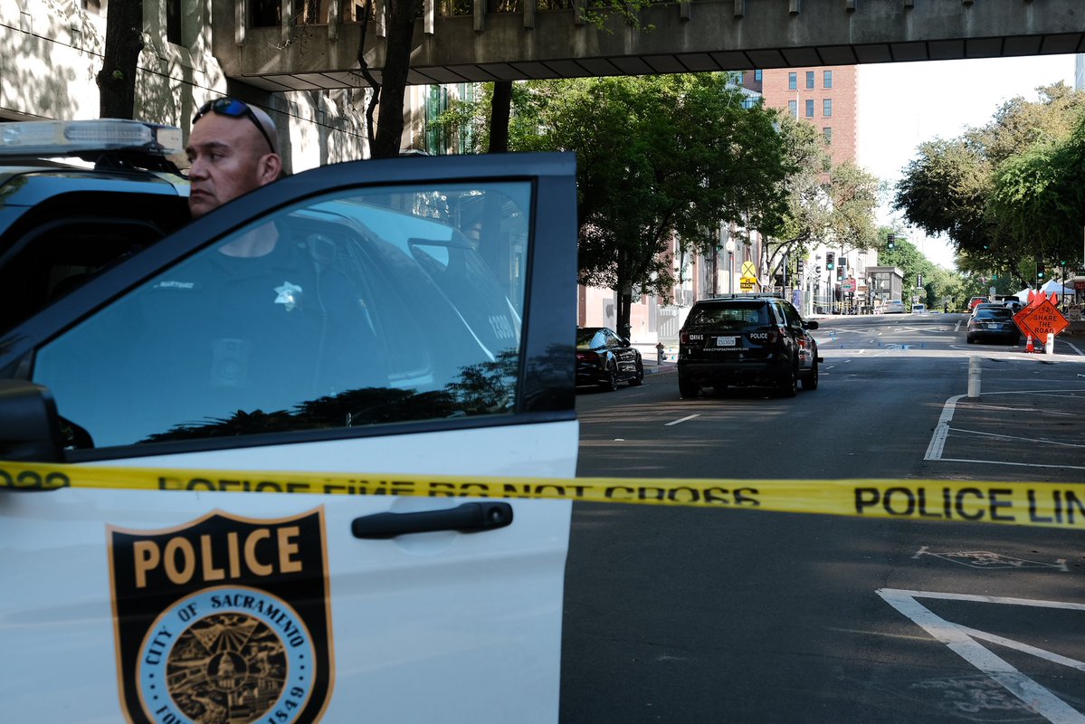 A vigil set on the ground on the corner of 10th and L street as police closed off the scene of the Sacramento shooting