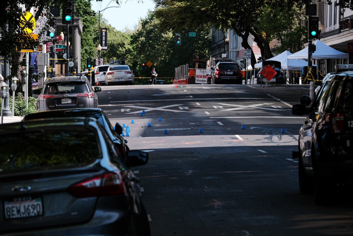 A vigil set on the ground on the corner of 10th and L street as police closed off the scene of the Sacramento shooting