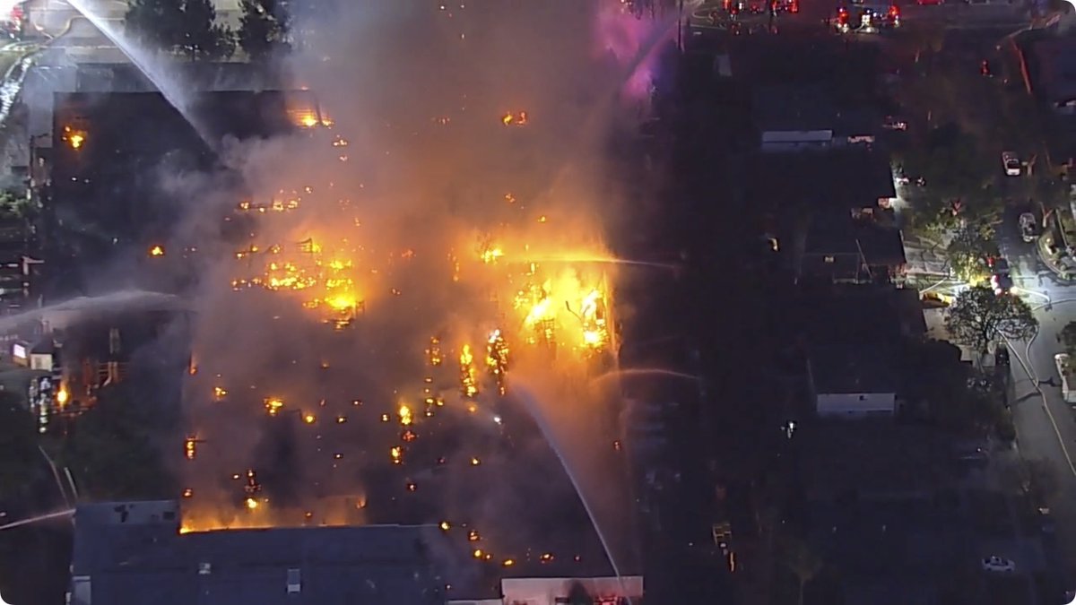 Helicopter is back over the fire, and while it's a bit hard to tell from this screencap, it looks like there's some stuff burning kind of blue-white inside there