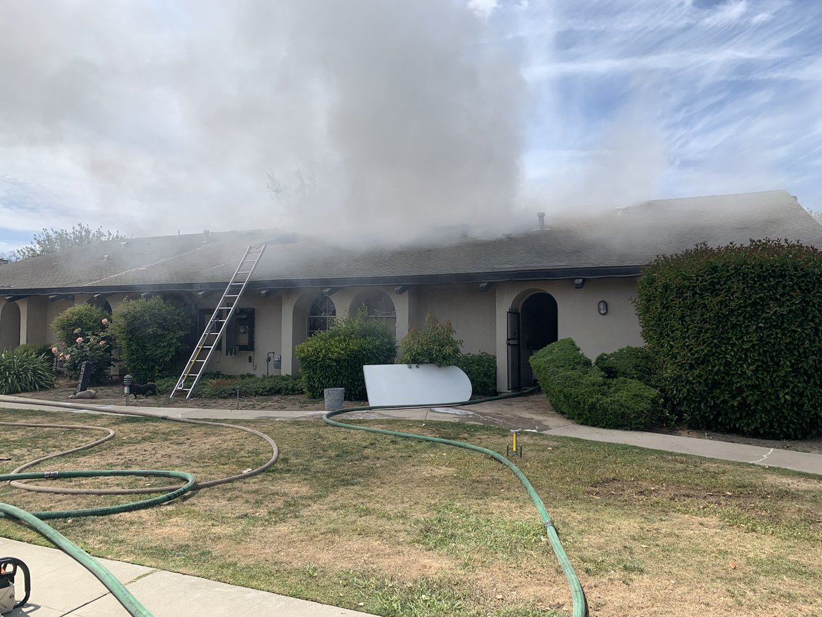 It looks like firefighters have things mostly under control. I overheard them talking about an offensive strategy and trying to isolate the fire to the attic. It hasn't spread out further than this building. No word yet one how the fire started