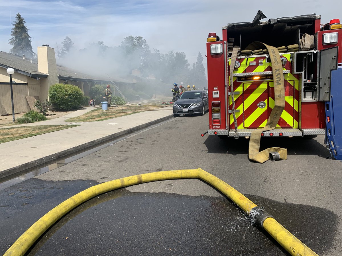 It looks like firefighters have things mostly under control. I overheard them talking about an offensive strategy and trying to isolate the fire to the attic. It hasn't spread out further than this building. No word yet one how the fire started