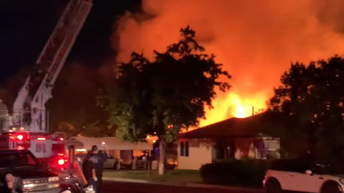 A massive fire spread quickly and caused damage to several homes on Liberty Street in Visalia, leaving one woman without a home