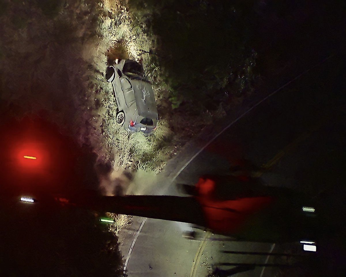 LAPD K-9 units have arrived the end of a wild police chase on Mulholland Dr in the Hollywood Hills The driver is refusing to exit stolen SUV after losing control and crashing along steep hillside