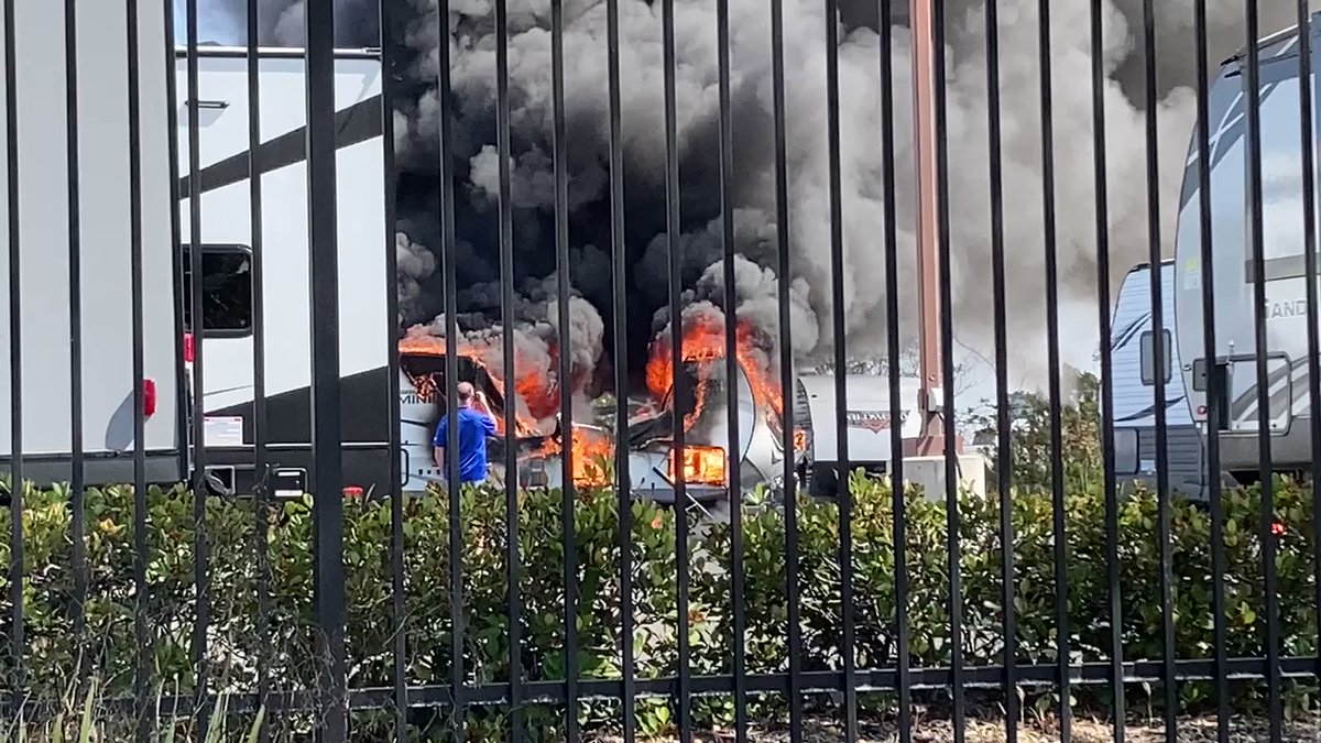 A fire in an RV sales lot in Kearny Mesa sends a black Plume of smoke into the sky firefighters are fighting  it now. But the smoke could be seen from quite a distance