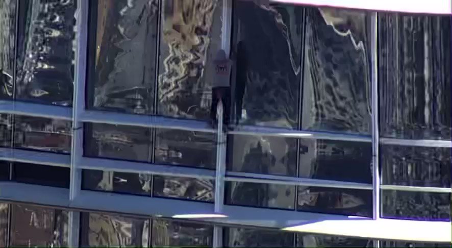 Individual climbing Salesforce Tower skyscraper in San Francisco, California  Emergency crews are on scene. The man can be seen near the 60th floor of the building at this time. This is an ongoing situation