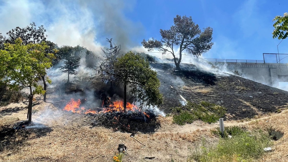 Fire in a homeless encampment along HWY 101 and Airport BLVD in Salinas. Fire crews getting it knocked down despite the windy dry conditions