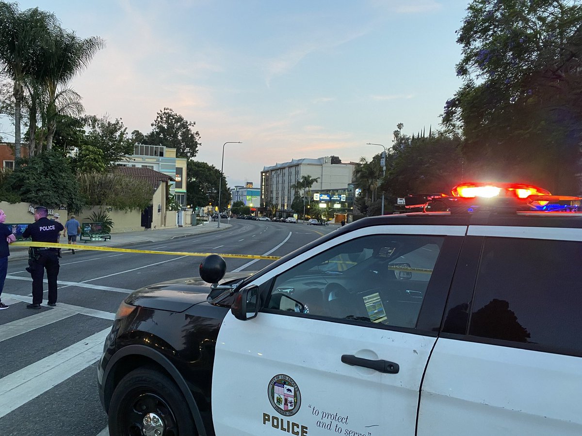 Highland Ave in Hollywood closed between Franklin and Odin because of investigation into police shooting. LAPD says officer shot burglary suspect who had a handgun. Man injured. 